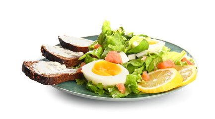 Plate of delicious salad with boiled eggs and cream cheese sandwiches isolated on white background