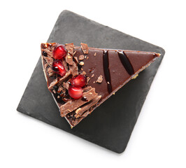 Slate board with piece of tasty birds milk cake on white background