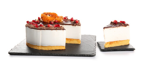 Slate boards with tasty birds milk cake on white background