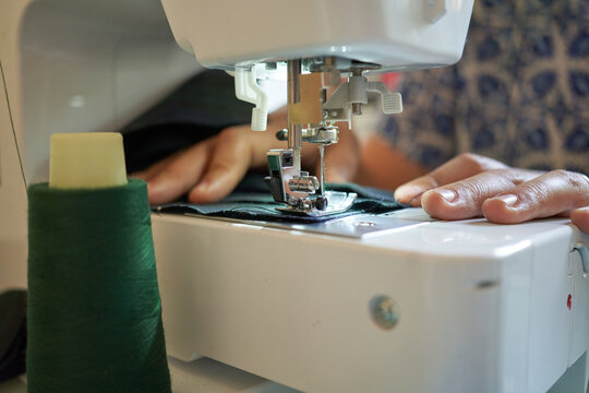 seamstress working on sewing machine