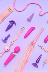Different sex toys on lilac background