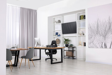 Stylish office with comfortable furniture and tv zone. Interior design