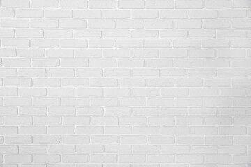 Fototapeta na wymiar Decorative white bricks with tile leveling system on wall