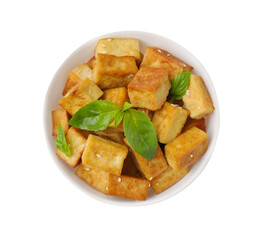 Plate with delicious fried tofu, basil and sesame seeds isolated on white, top view