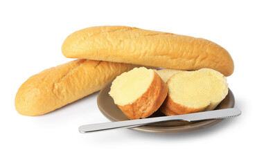 Whole and cut baguettes with fresh butter on white background