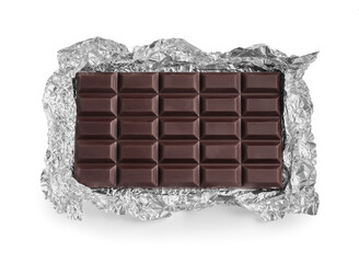 Delicious dark chocolate bar with foil isolated on white, top view