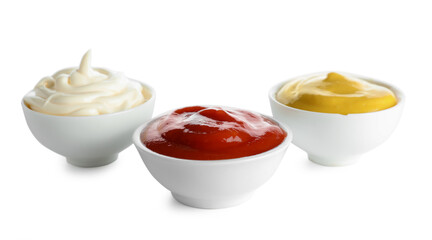 Bowls with different sauces isolated on white background