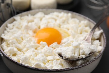 Bowl with ingredients for cooking cottage cheese pancakes, closeup