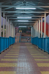 an empty'rail over bridge in night time