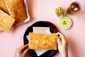 Fried Pastry, Pastel, Brazilian snack, woman hand, top view