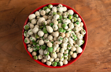 A Bowl of Green Wasabi Peas on a Table