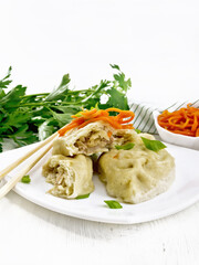 Patties pegodi with spicy carrots in plate on white board