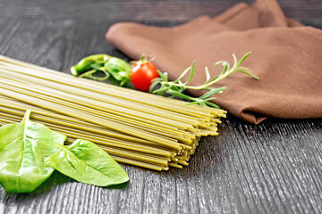 Spaghetti spinach on wooden board