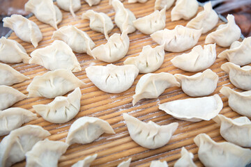 Wrapped uncooked white flour dumplings
