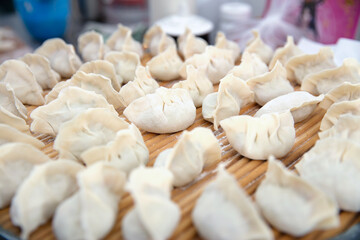 Wrapped uncooked white flour dumplings