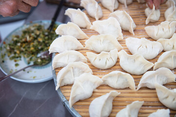 Wrapped uncooked white flour dumplings