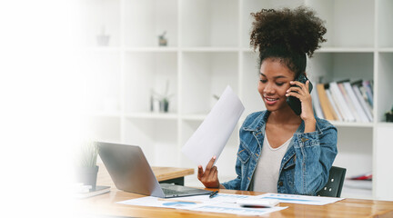 Corporate Communication. Black Businesswoman Talking On Mobile Phone Working On Laptop In Modern...