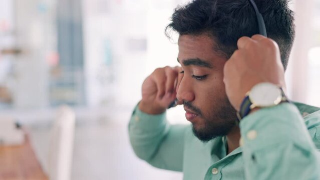 Call center, telemarketing and man with headset, start day and customer services in workplace. Male employee, consultant and agent with headphones, prepare for client and tech support in office