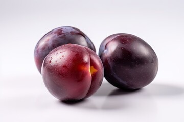 Closeup of Plums on a white background. Created by Generative AI technology.