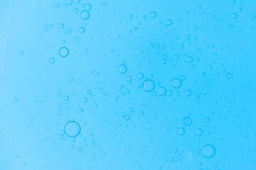 Air bubbles in the water background.Abstract oxygen bubbles in the sea.Water bubbles isolate on blue background.Air bubble floating up to top of water surface which little and big circle shape.
