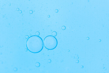 Air bubbles in the water background.Abstract oxygen bubbles in the sea.Water bubbles isolate on blue background.Air bubble floating up to top of water surface which little and big circle shape.