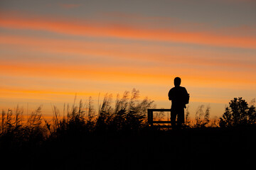 silhouette of a man at sunset.