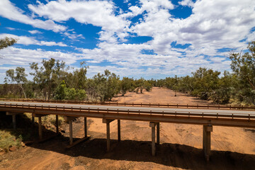 Old bridge over a dried out river in drought