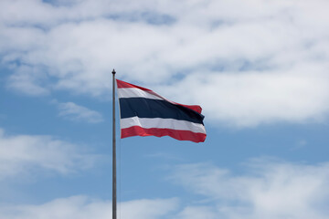 Thai flag on blue sky.