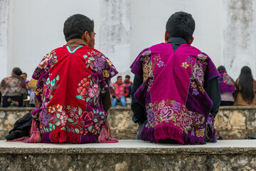 Tzeltal Maya mexican indigenous men in traditional clothing by San Lorenzo church, Zinacantan,...