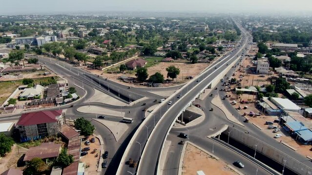 Highway crossroad and interchange at Yola Town, Nigeria - pull back aerial reveal