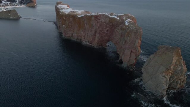 Cinematic drone shot of famous Perce rock in Quebec, Canada
