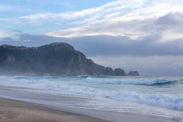 Fototapeta na wymiar Big storm waves of Mediterranean sea on Alanya beach Turkey coast