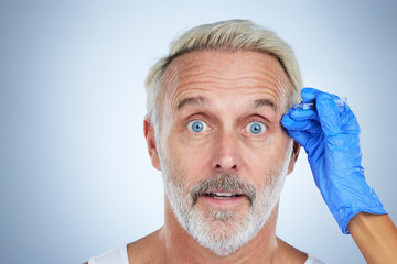 Botox, portrait and surprise of a senior man in a studio doing plastic surgery and cosmetic...