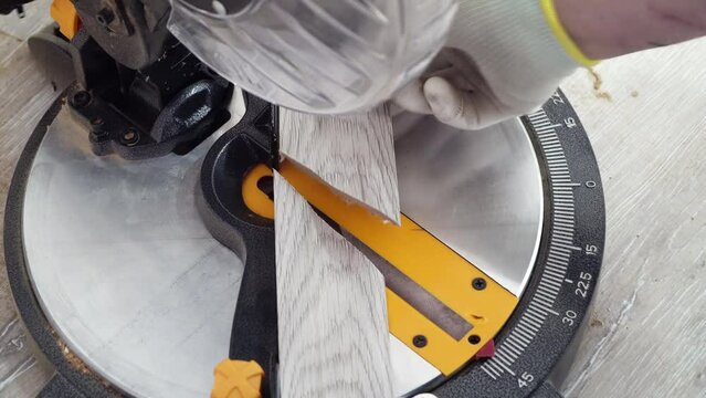 Miter Saw, electric power carpentry tools. cutting batten for laminate floor