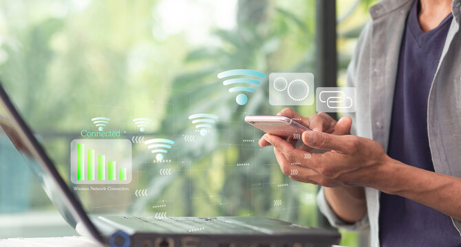person setting wifi on smartphone to connection with laptop while woking at home or cafe