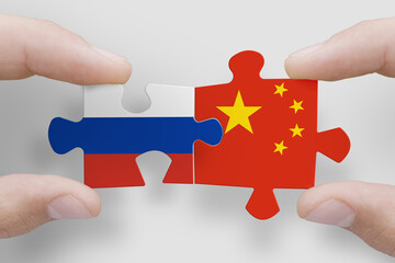 Puzzle made from flags of Russia and China. Russia and China relations and military collaboration