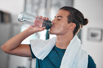 Fitness, man and drinking water for hydration after workout, exercise or intense training at home....