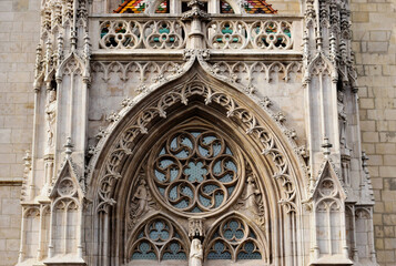 richly decorated stone elevation detail of gothic cathedral in Budapest. the Matthias church in the castle district. famous landmark. carved sculptures and decorative elements. travel and tourism..