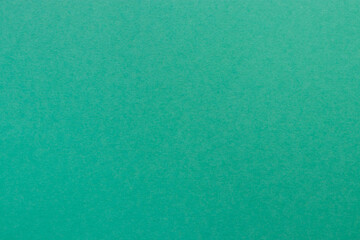 Turquoise colored tinted paper sheet background.  Blue green mineral color shade.