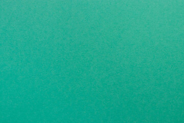 Turquoise colored tinted paper sheet background.  Blue green mineral color shade.