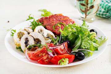 Ketogenic breakfast. Chicken roll stuffed with mushrooms, beetroot fritters and fresh vegetable salad. Keto, ketogenic lunch.
