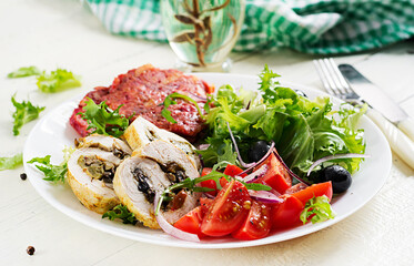 Ketogenic breakfast. Chicken roll stuffed with mushrooms, beetroot fritters and fresh vegetable salad. Keto, ketogenic lunch.