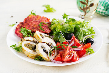 Ketogenic breakfast. Chicken roll stuffed with mushrooms, beetroot fritters and fresh vegetable salad. Keto, ketogenic lunch.
