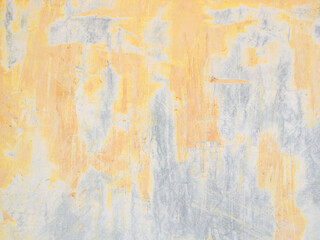 decorative ornament of peeling yellow wall paint background