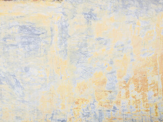 decorative ornament of peeling yellow wall paint background