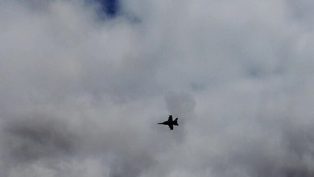 FA-18F Super Hornet Jet Flying Against Cloudy Sky. low angle, tracking shot