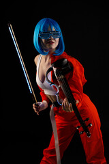 Fototapeta na wymiar Violinist woman in the cyberpunk costume on the black background.