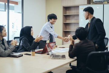 Business people shaking hands, finishing up a meeting. Professional businesspeople reached agreement on negotiations. 