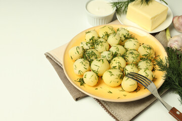 Concept of tasty food with boiled young potatoes, space for text