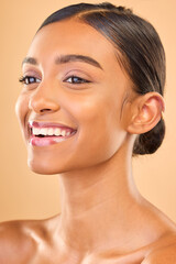 Obraz premium Skin care, face and smile of woman in studio for glow, cosmetics, dermatology or makeup. Aesthetic female .happy about self love, natural skincare and spa facial shine results on a brown background